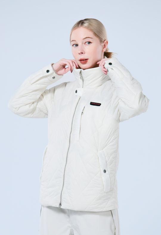 A lady wearing a heated white puffer jacket with mock neck 